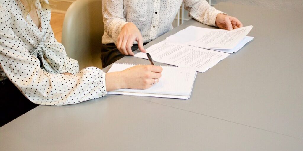 two-women-signing-contract